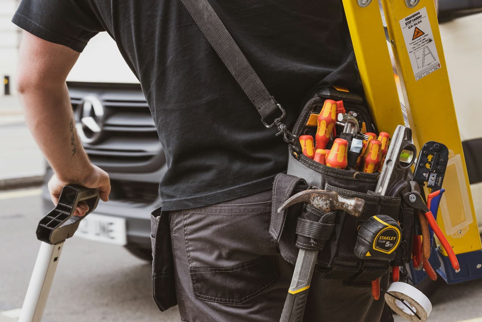 Vantage Systems engineer on site with power tools in hand