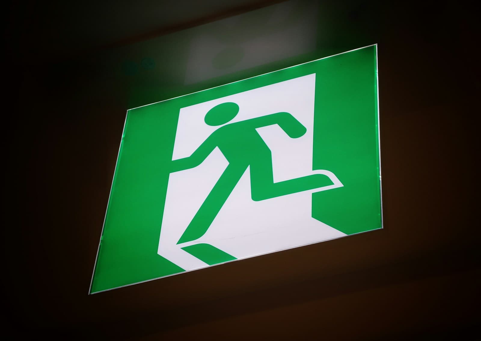Illuminated green fire exit sign