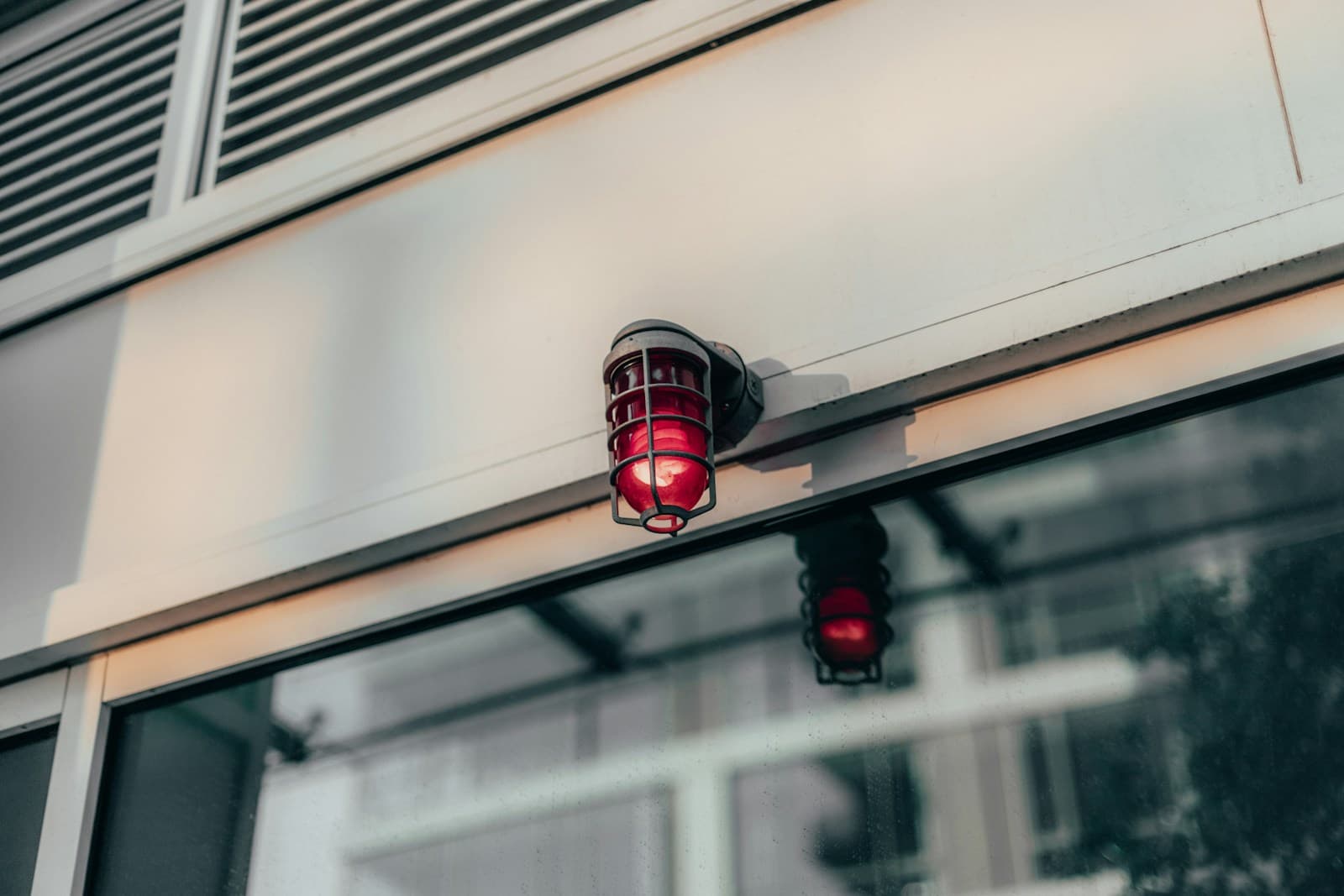 Flashing red alarm beacon at night